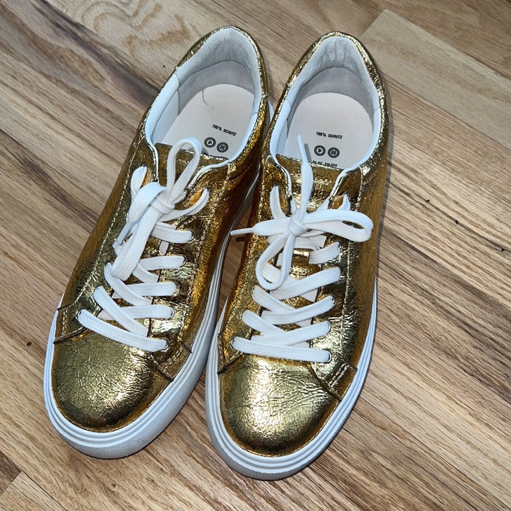 Schutz gold foil sneakers